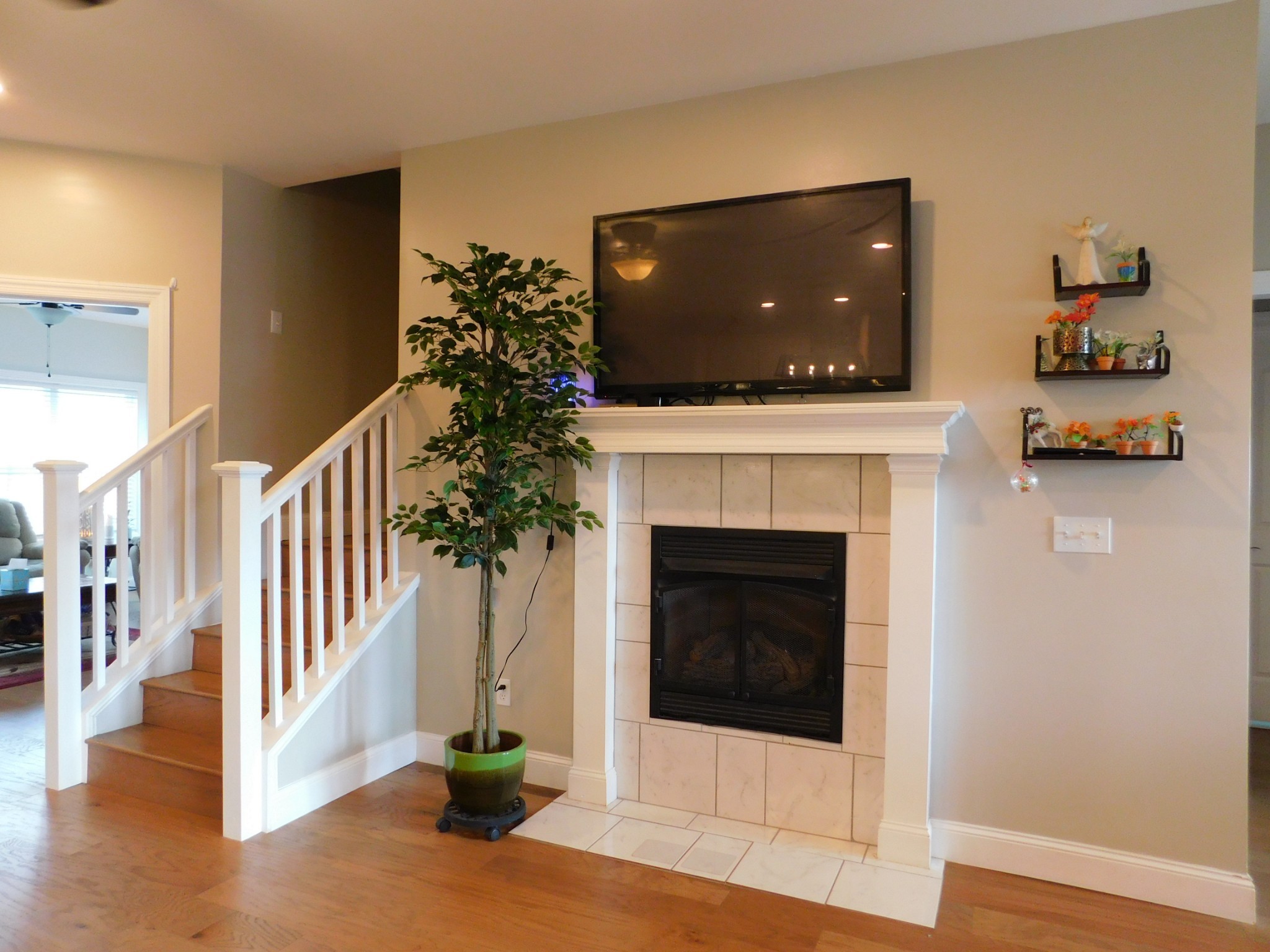 34 Oak Hollow Road Manchester, TN 37355 - Photo 7 of 36 a living room with a fireplace and a flat screen tv