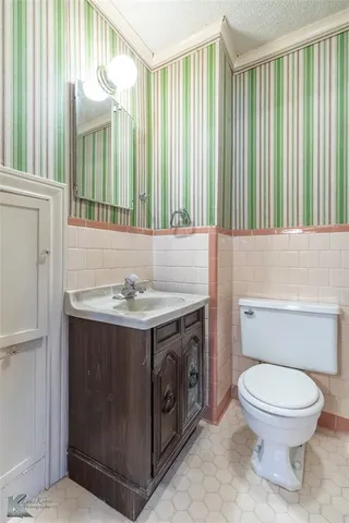 a bathroom with a sink a toilet and tub