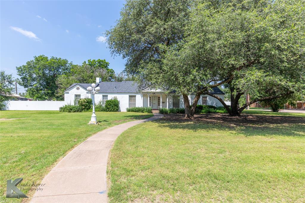 907 North Ave G Haskell, TX 79521 - Photo 2 of 40 a view of a house with swimming pool and sitting area