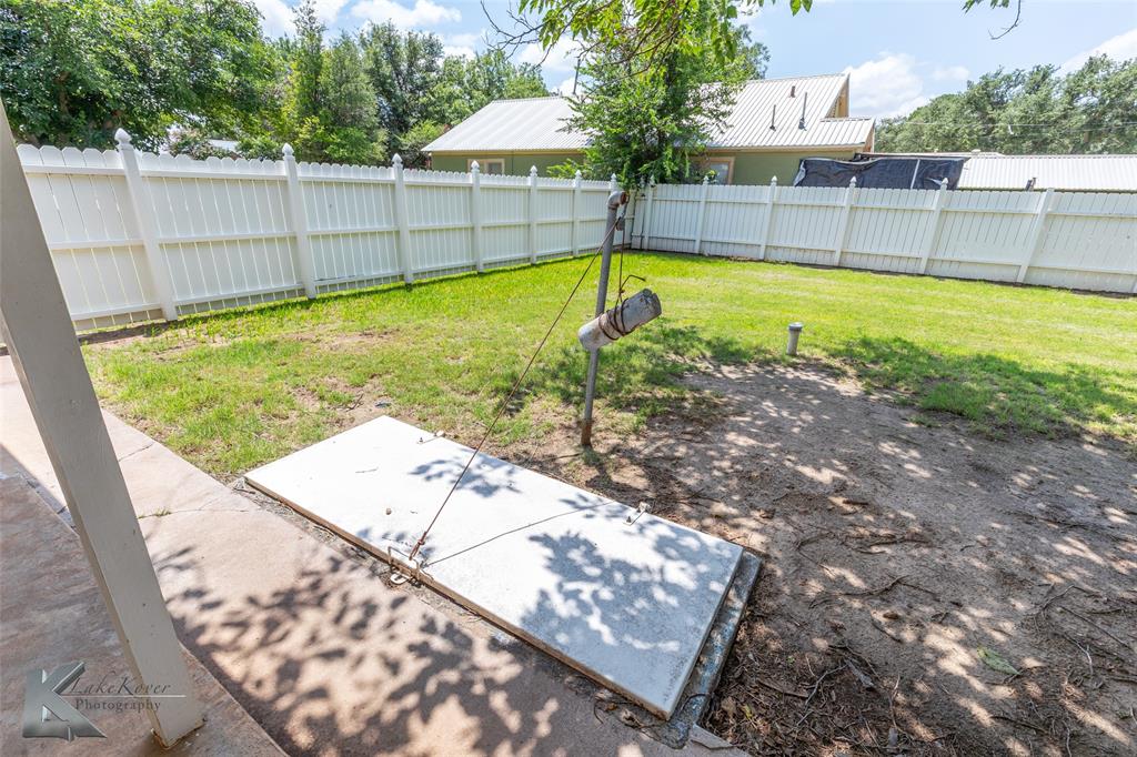 907 North Ave G Haskell, TX 79521 - Photo 24 of 40 a view of a backyard with a swimming pool and sitting area