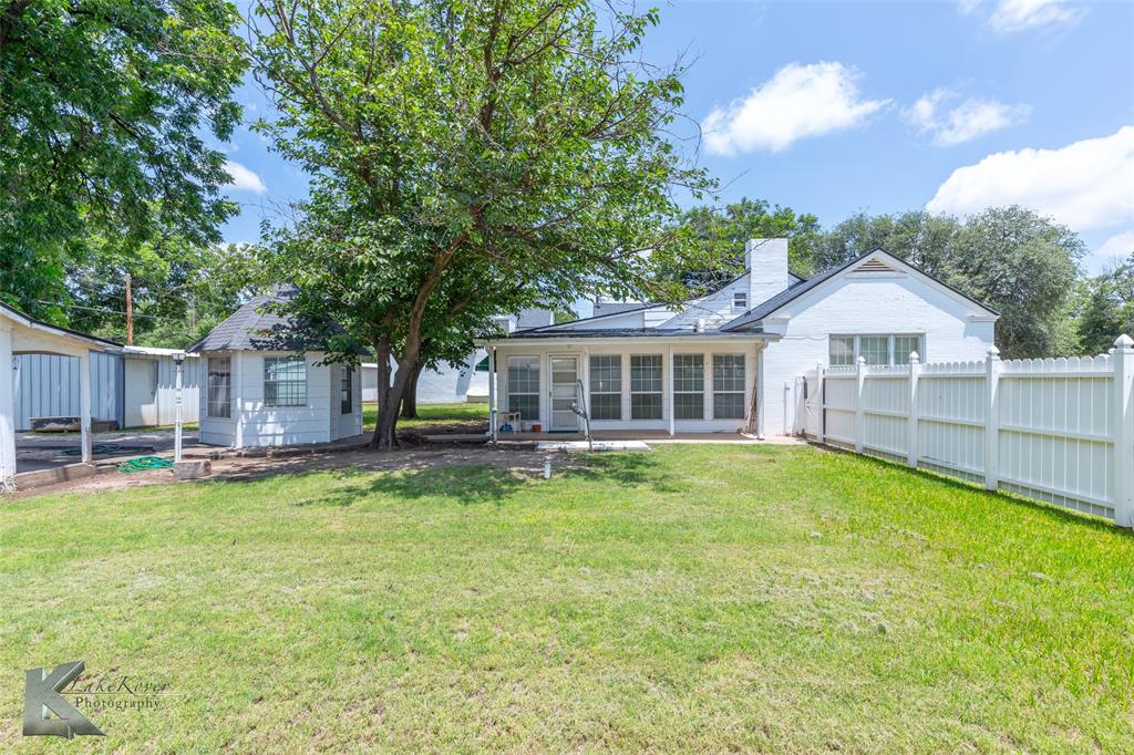 907 North Ave G Haskell, TX 79521 - Photo 25 of 40 a view of a house with a big yard and large trees