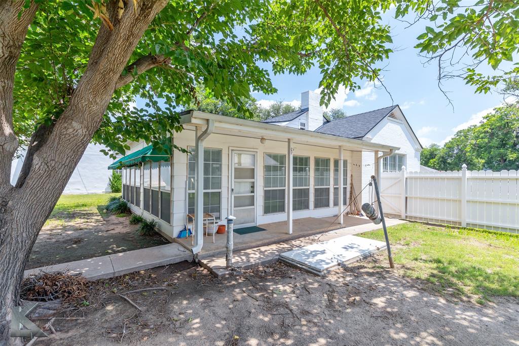 907 North Ave G Haskell, TX 79521 - Photo 26 of 40 a view of a house with backyard and a tree