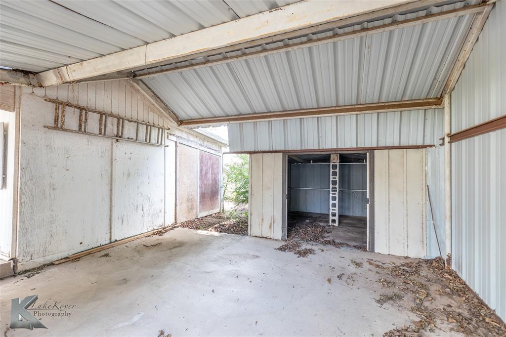 907 North Ave G Haskell, TX 79521 - Photo 28 of 40 a view of a house with wooden wall and roof