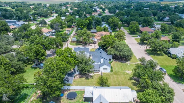 an aerial view of residential house with outdoor space