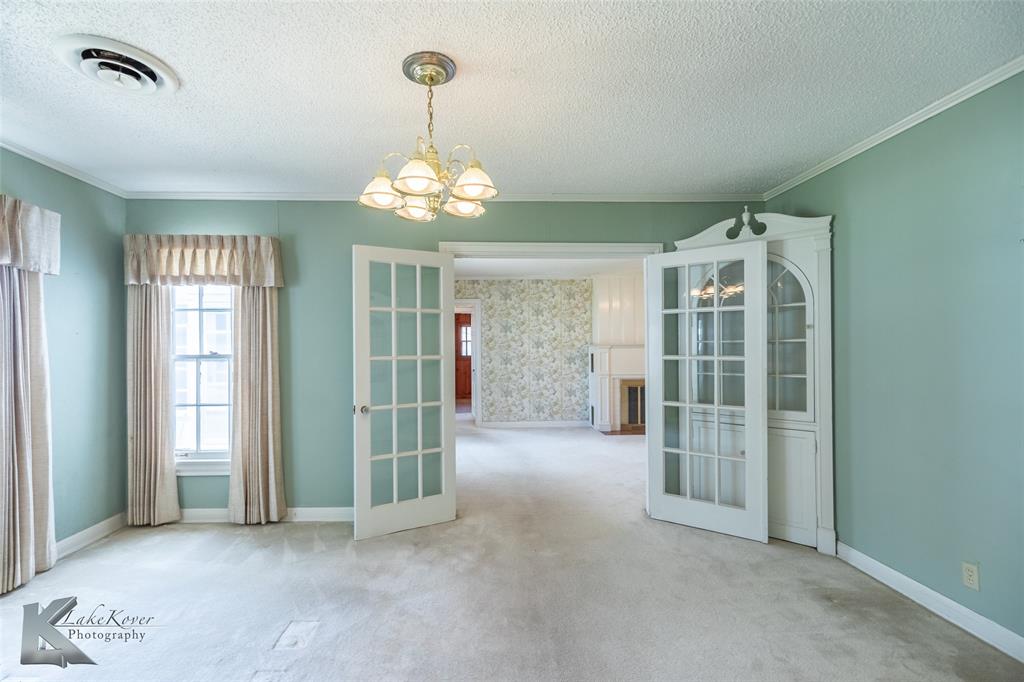 907 North Ave G Haskell, TX 79521 - Photo 6 of 40 a view of a room with windows and chandelier