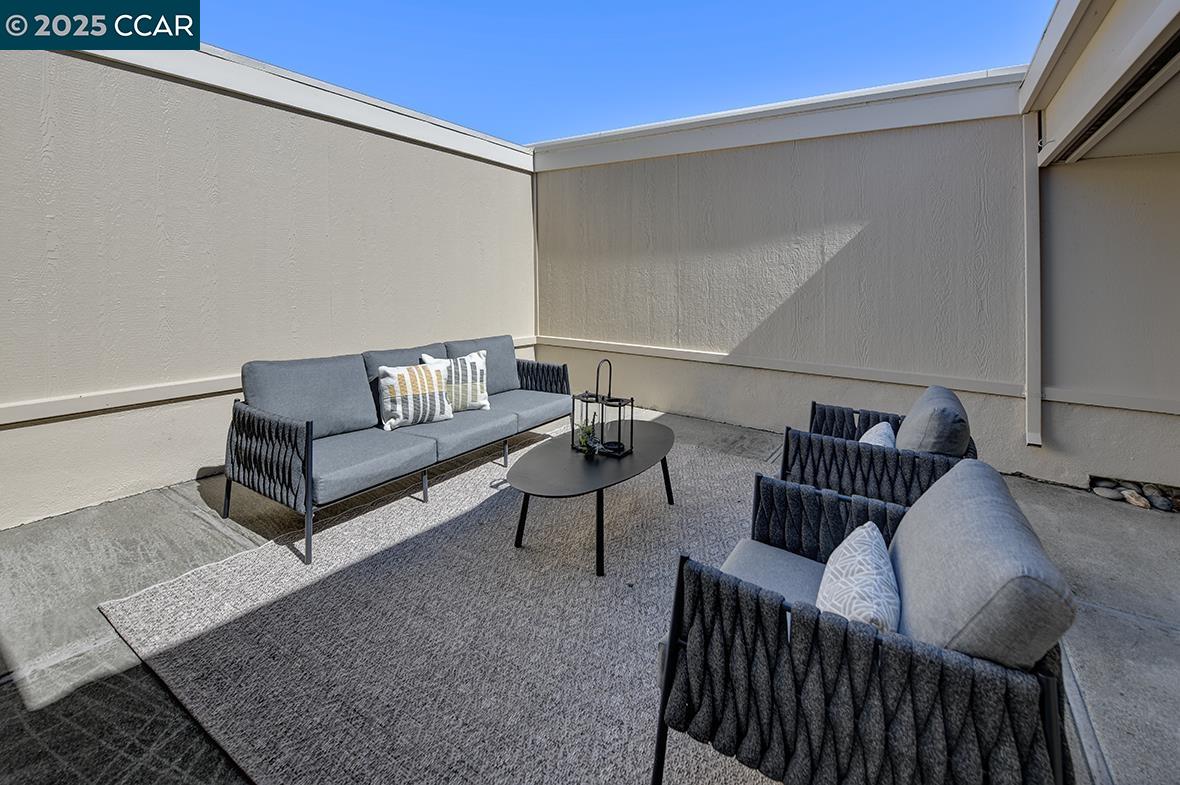 2041 Golden Rain Road, Unit 4 Walnut Creek, CA 94595 - Photo 12 of 53 a living room with furniture and a rug