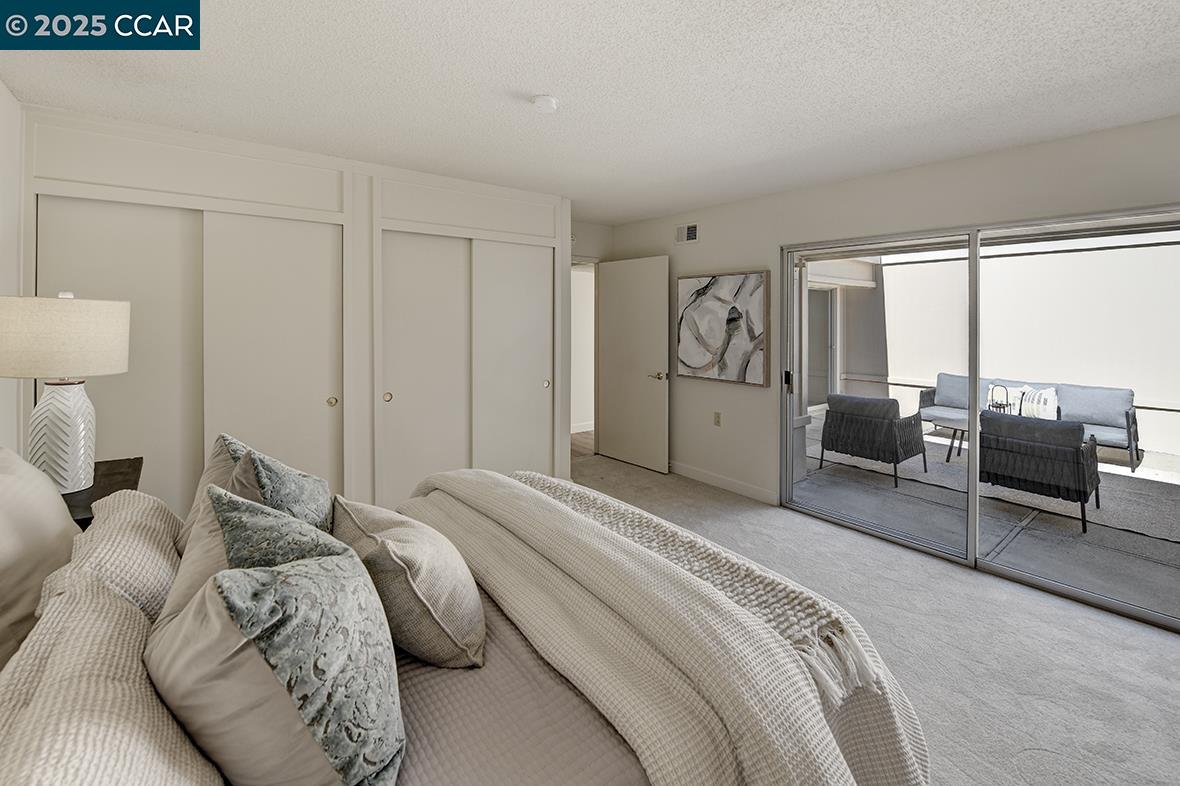 2041 Golden Rain Road, Unit 4 Walnut Creek, CA 94595 - Photo 18 of 53 a bedroom with a bed and furniture