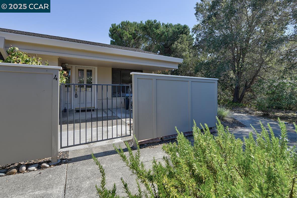 2041 Golden Rain Road, Unit 4 Walnut Creek, CA 94595 - Photo 2 of 53 a view of a house with a small yard and plants