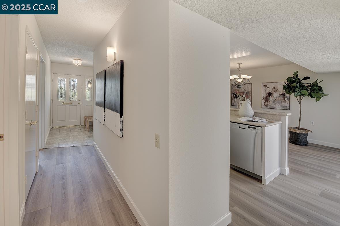 2041 Golden Rain Road, Unit 4 Walnut Creek, CA 94595 - Photo 21 of 53 a view of a hallway with wooden floor