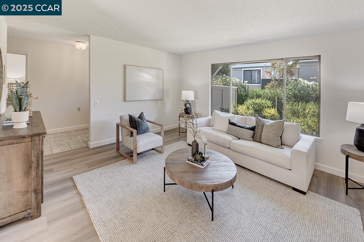 2041 Golden Rain Road, Unit 4 Walnut Creek, CA 94595 - Photo 26 of 53 a living room with furniture and a potted plant