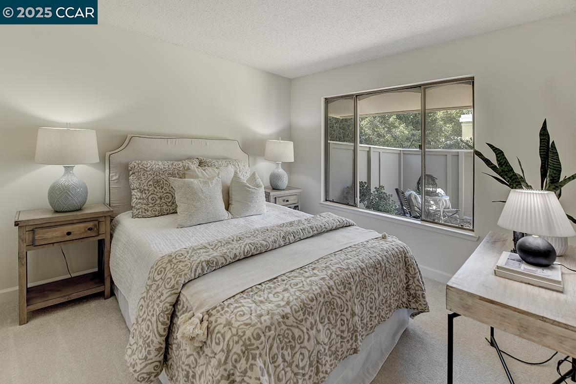 2041 Golden Rain Road, Unit 4 Walnut Creek, CA 94595 - Photo 27 of 53 a bedroom with a bed and a window