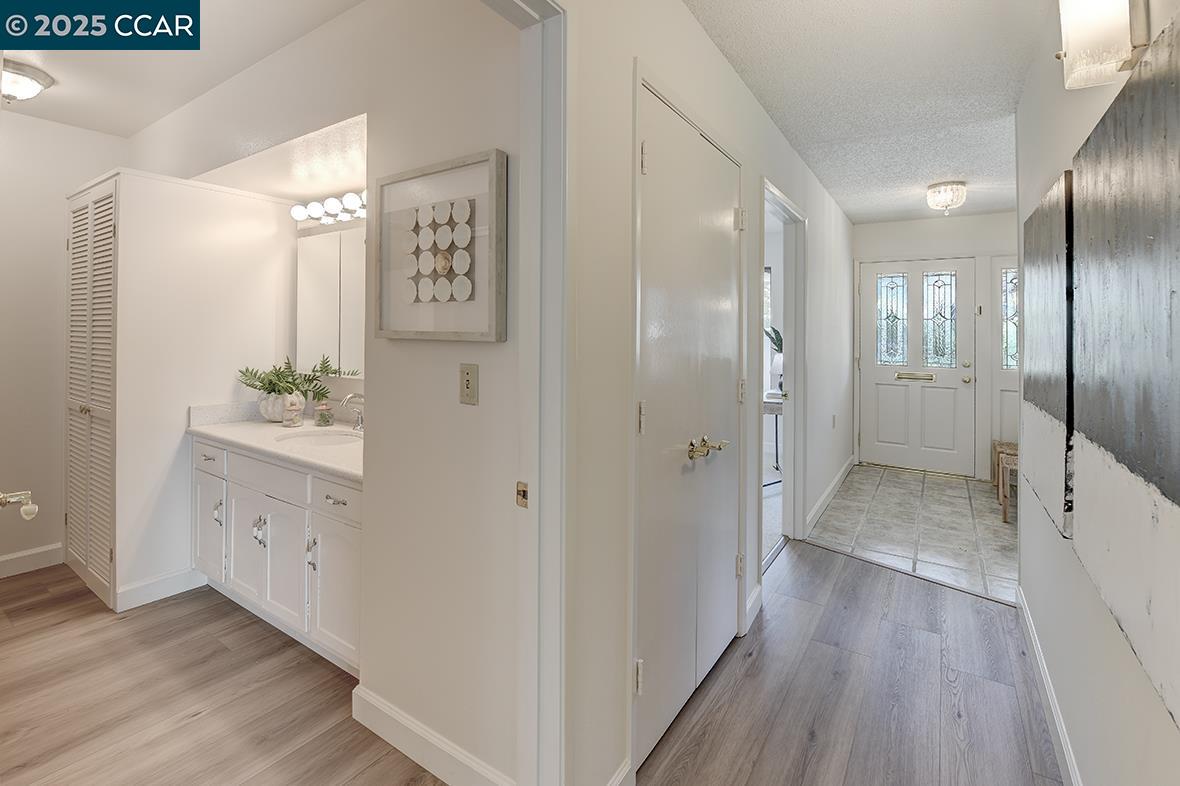 2041 Golden Rain Road, Unit 4 Walnut Creek, CA 94595 - Photo 32 of 53 a bathroom with a sink and a mirror