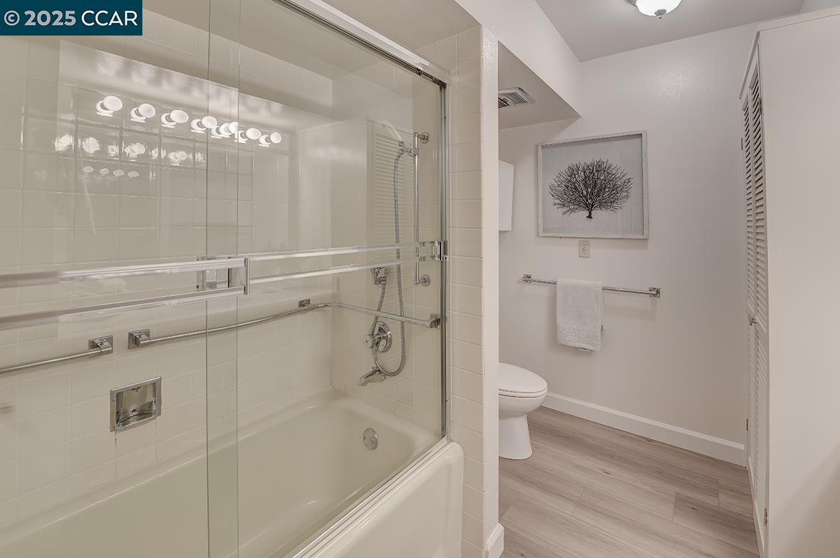 2041 Golden Rain Road, Unit 4 Walnut Creek, CA 94595 - Photo 34 of 53 a bathroom with a granite countertop sink toilet and shower