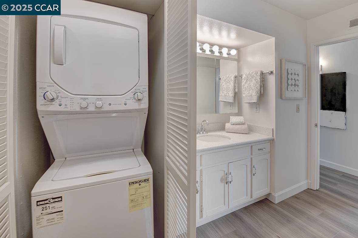 2041 Golden Rain Road, Unit 4 Walnut Creek, CA 94595 - Photo 35 of 53 a view of bathroom with a toilet a sink and a mirror