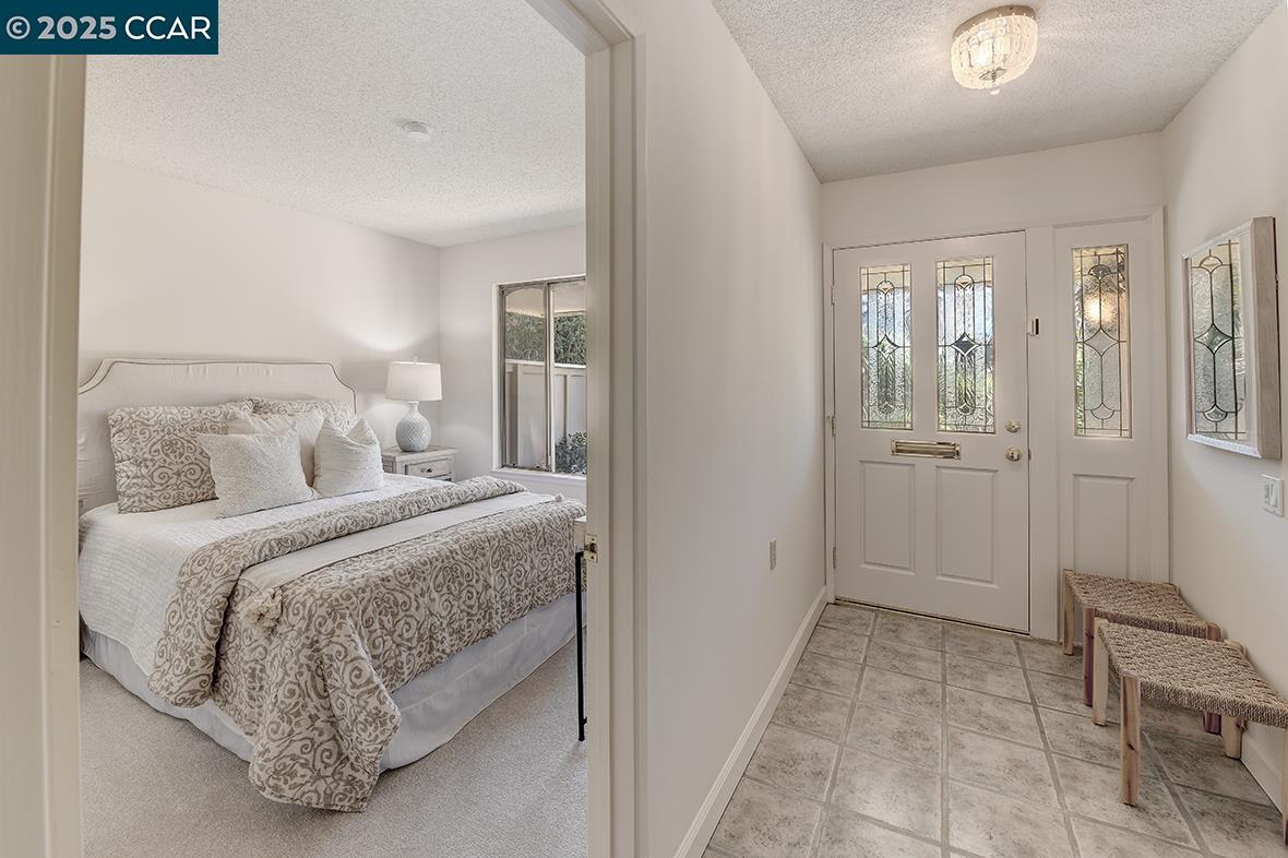 2041 Golden Rain Road, Unit 4 Walnut Creek, CA 94595 - Photo 37 of 53 a bedroom with a bed and a table