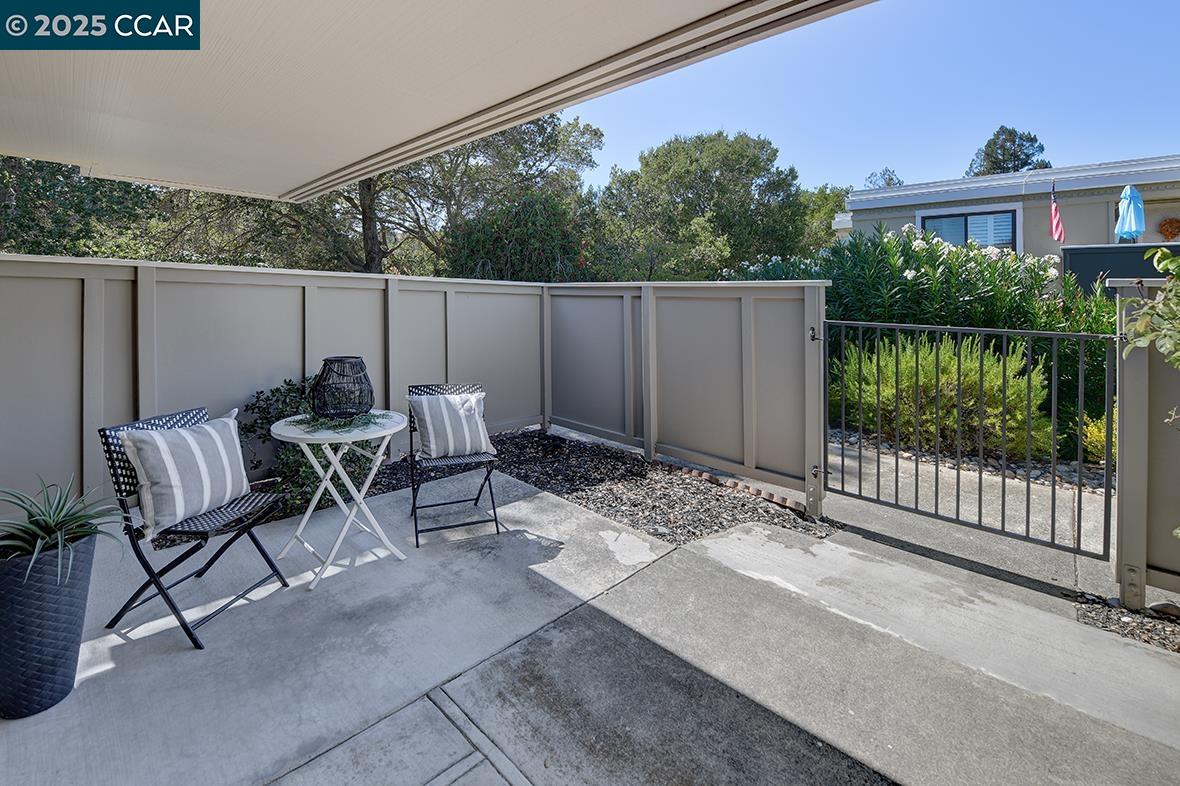 2041 Golden Rain Road, Unit 4 Walnut Creek, CA 94595 - Photo 39 of 53 a view of a patio with a table and chairs