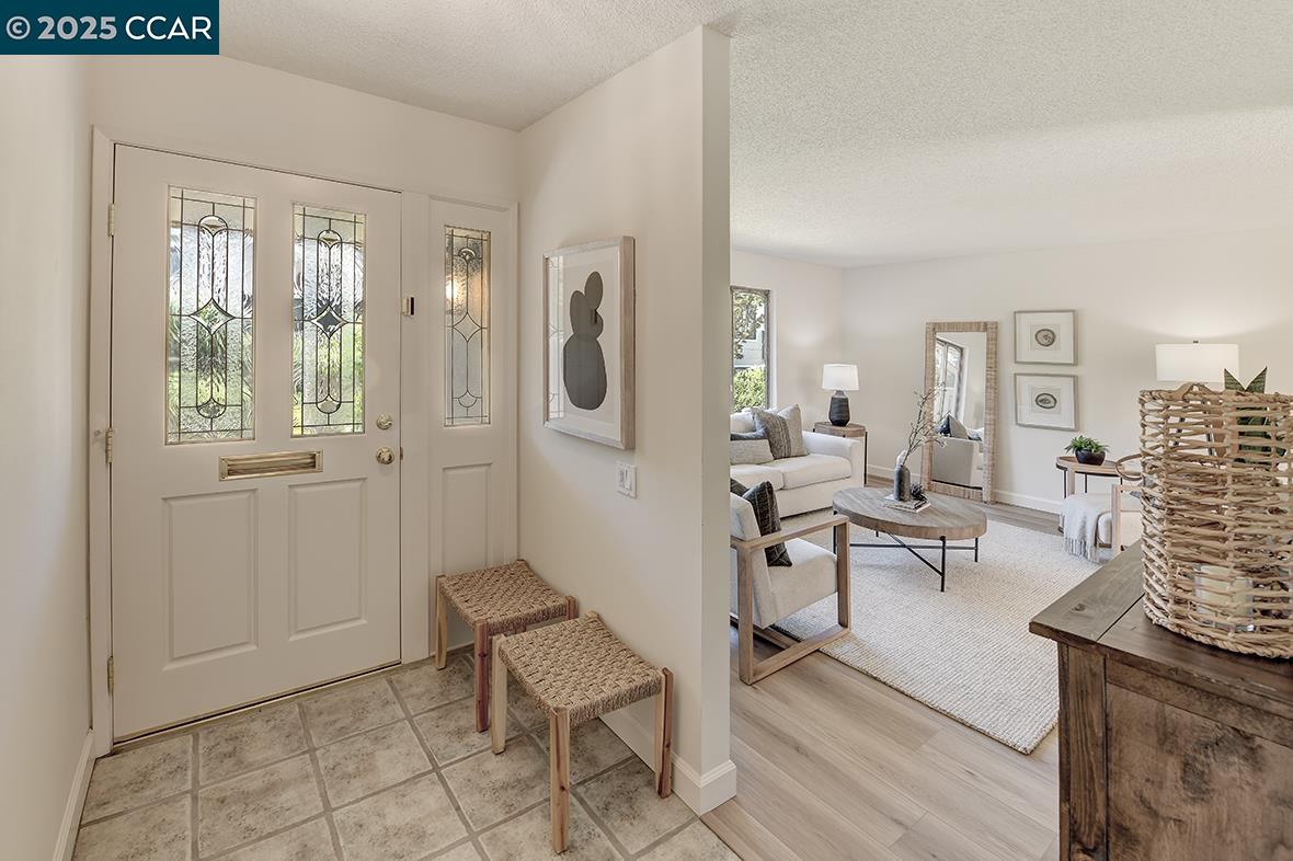 2041 Golden Rain Road, Unit 4 Walnut Creek, CA 94595 - Photo 6 of 53 a living room with furniture and a table
