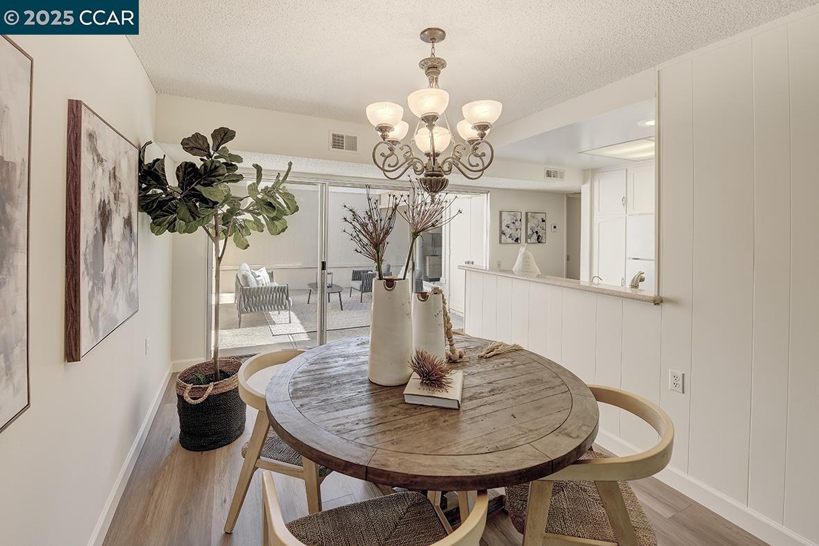 2041 Golden Rain Road, Unit 4 Walnut Creek, CA 94595 - Photo 10 of 53 a table with a vase and flowers on it