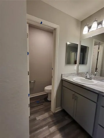 a bathroom with a shower sink and mirror