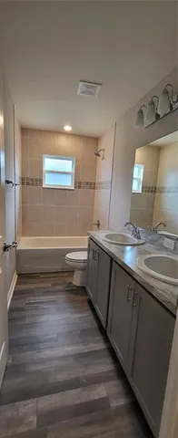 a view of hallway with wooden floor