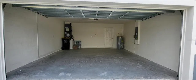 a view of a large room with furniture and a large window