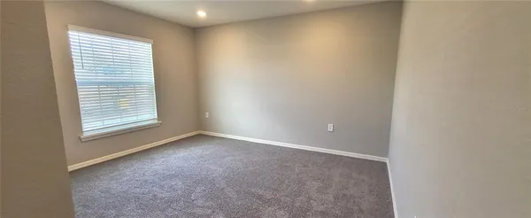 a view of hallway with wooden floor