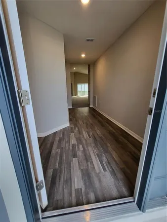 a view of a kitchen with a sink and a stove top oven