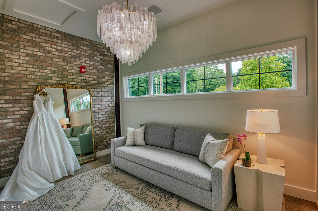 1019 Hardscrabble Road Mineral Bluff, GA 30559 - Photo 12 of 52 a living room with furniture and a large window