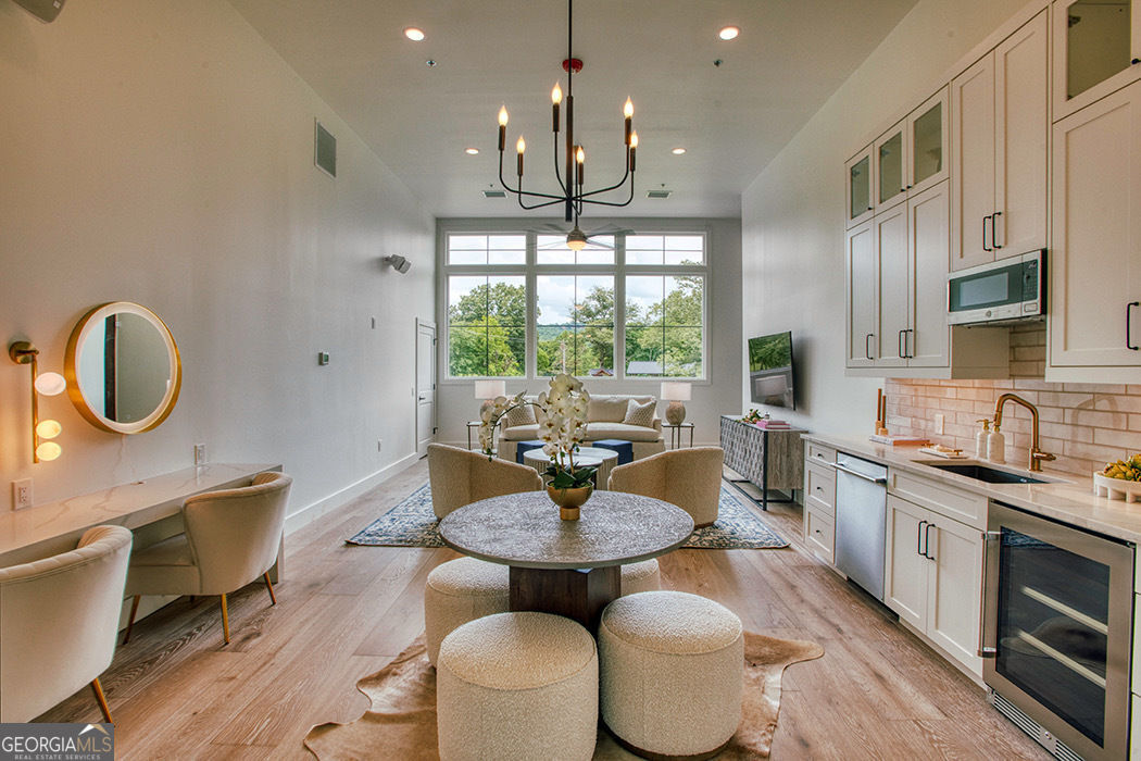 1019 Hardscrabble Road Mineral Bluff, GA 30559 - Photo 13 of 52 a kitchen with sink a stove a dining table and chairs