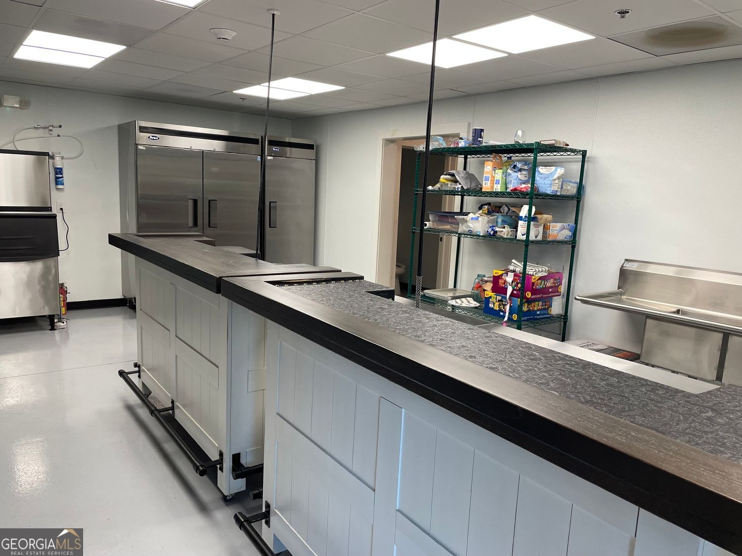 1019 Hardscrabble Road Mineral Bluff, GA 30559 - Photo 14 of 52 a kitchen with kitchen island granite countertop a sink and a stove