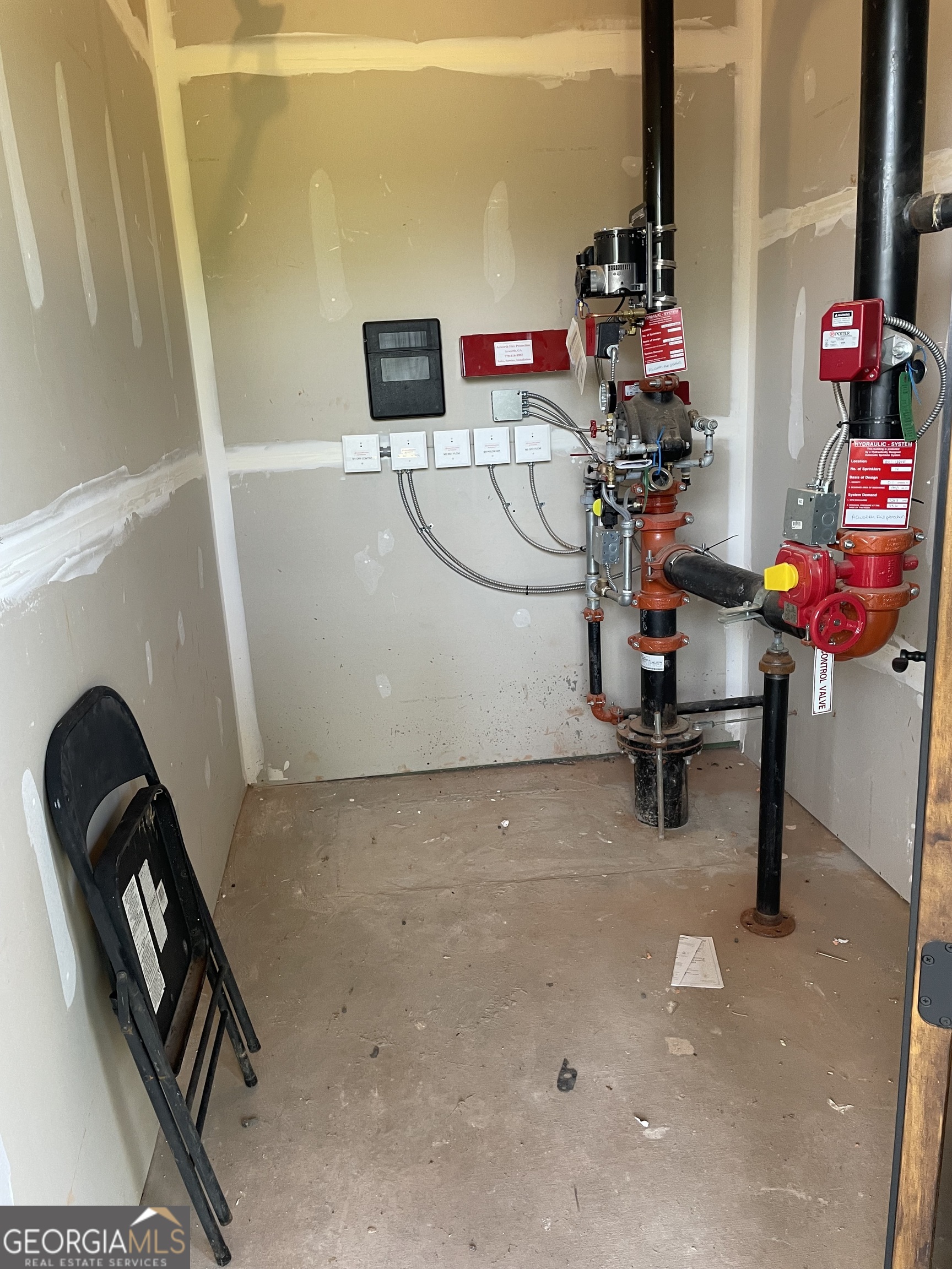 1019 Hardscrabble Road Mineral Bluff, GA 30559 - Photo 21 of 52 a view of storage and utility room with racks on the wall