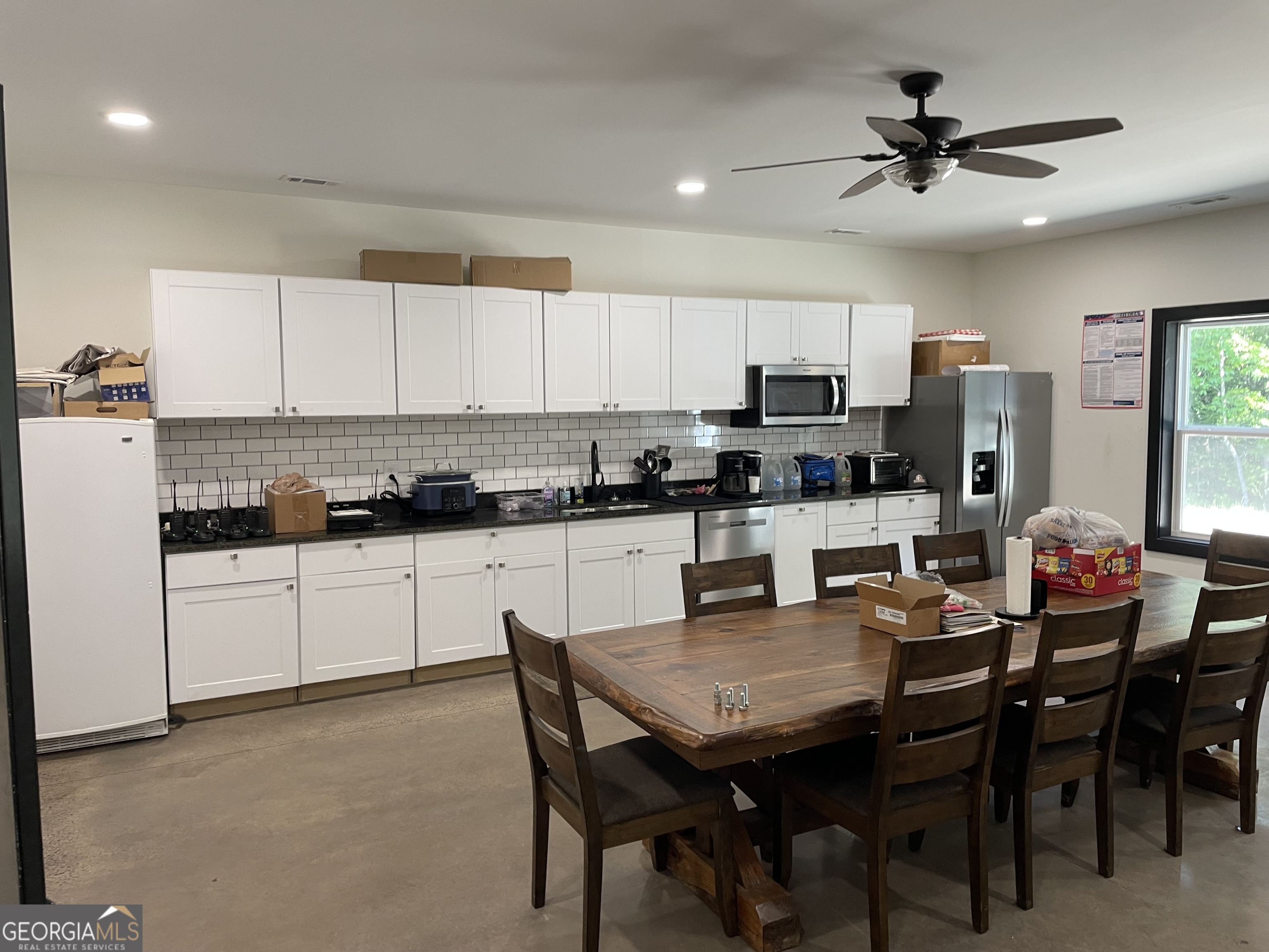 1019 Hardscrabble Road Mineral Bluff, GA 30559 - Photo 29 of 52 a view of kitchen with cabinets stainless steel appliances dining table and chairs