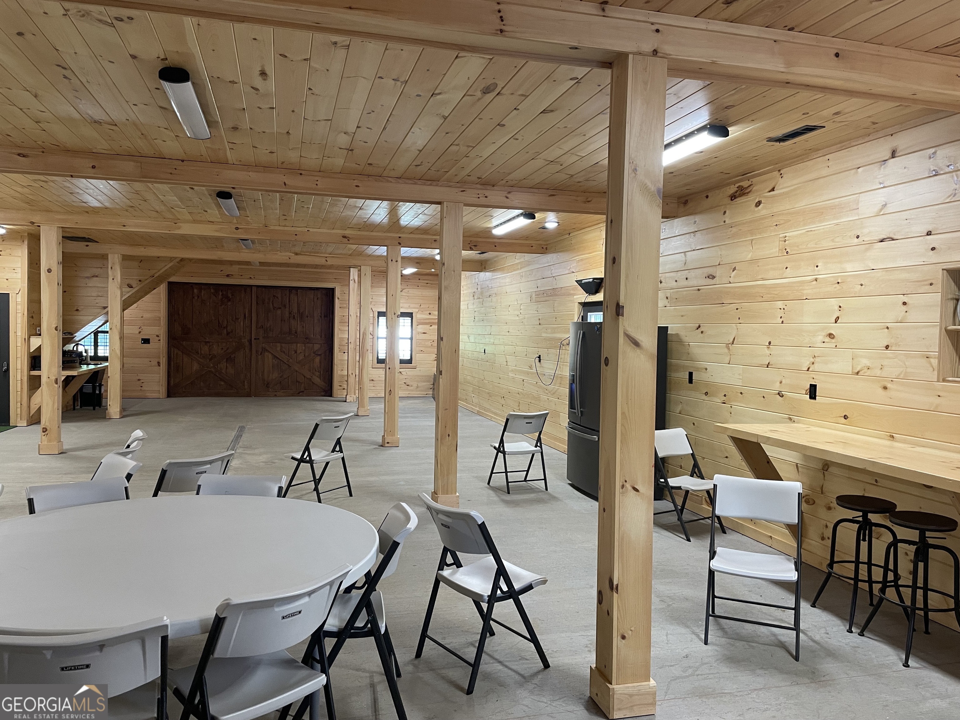 1019 Hardscrabble Road Mineral Bluff, GA 30559 - Photo 43 of 52 a view of a dining room with furniture and a chandelier
