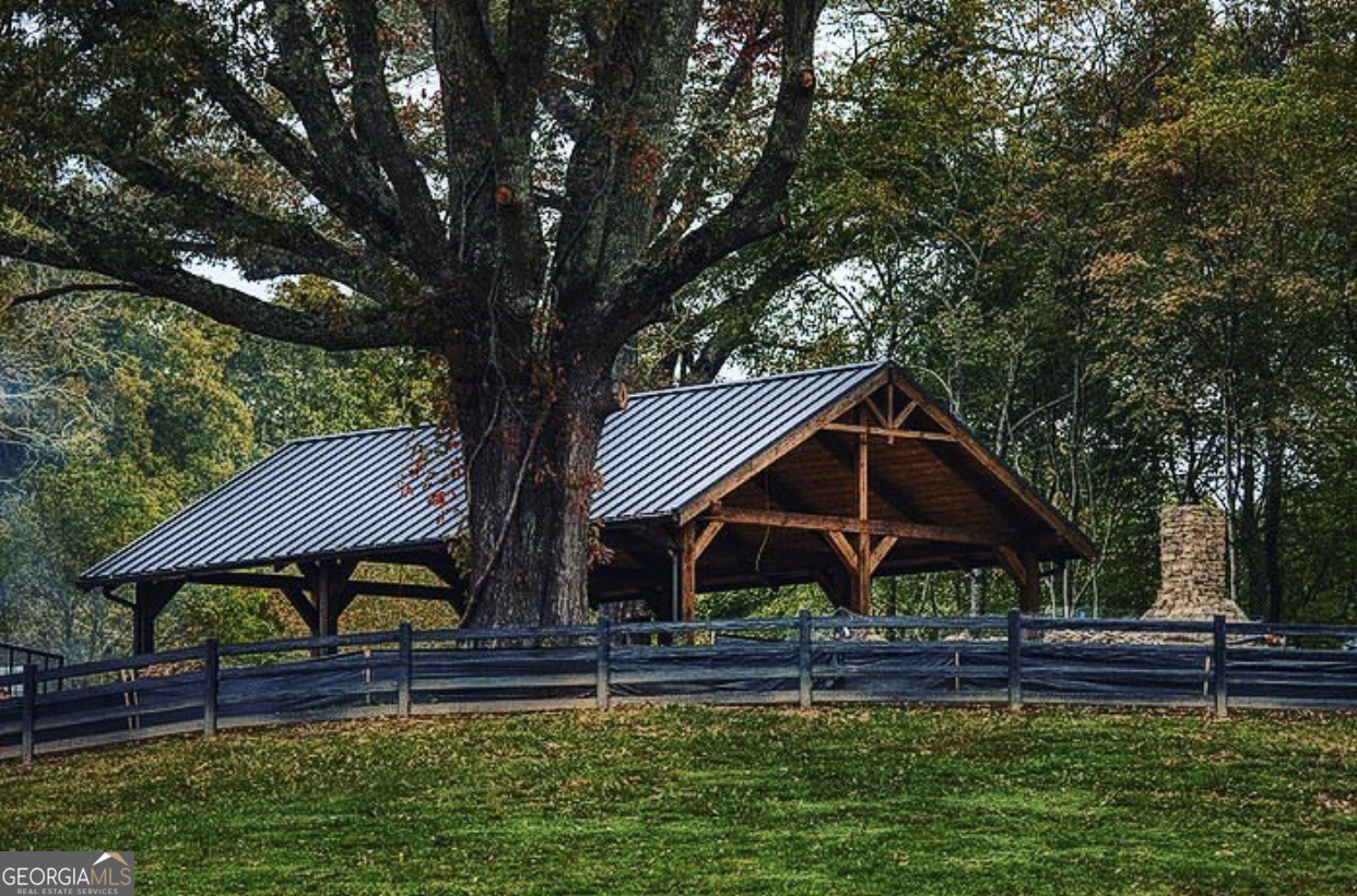 1019 Hardscrabble Road Mineral Bluff, GA 30559 - Photo 46 of 52 a front view of a house with garden