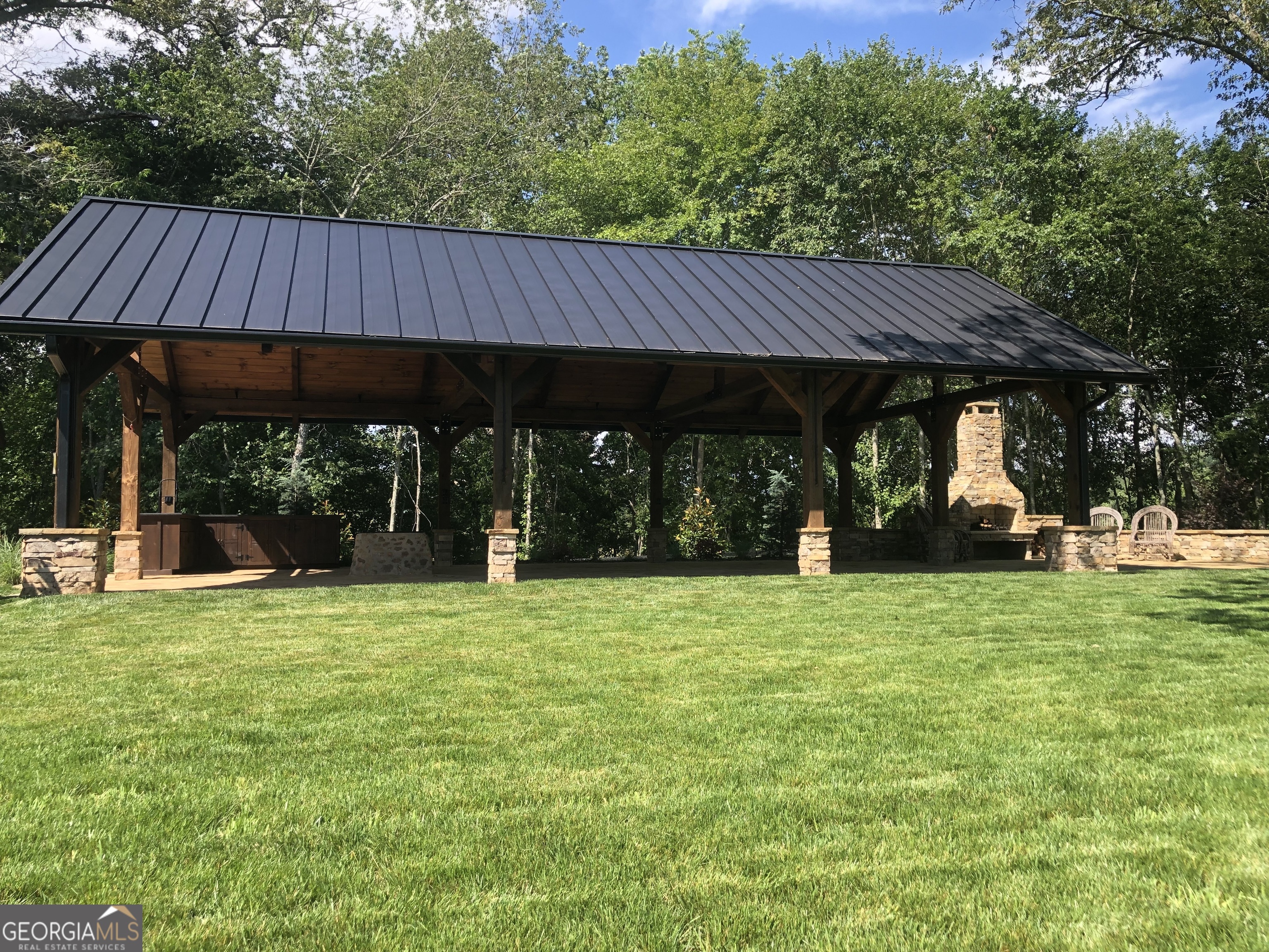 1019 Hardscrabble Road Mineral Bluff, GA 30559 - Photo 49 of 52 a view of a house with backyard and sitting area