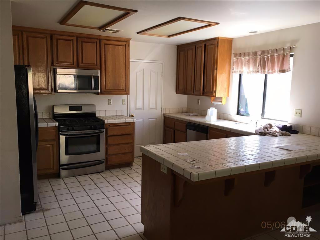 59371 Devils Ladder Road Mountain Center, CA 92561 - Photo 3 of 12 a kitchen with a sink appliances and cabinets