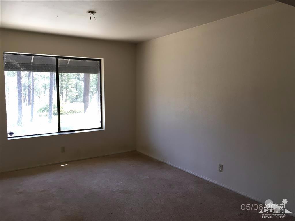 59371 Devils Ladder Road Mountain Center, CA 92561 - Photo 6 of 12 an empty room with a window