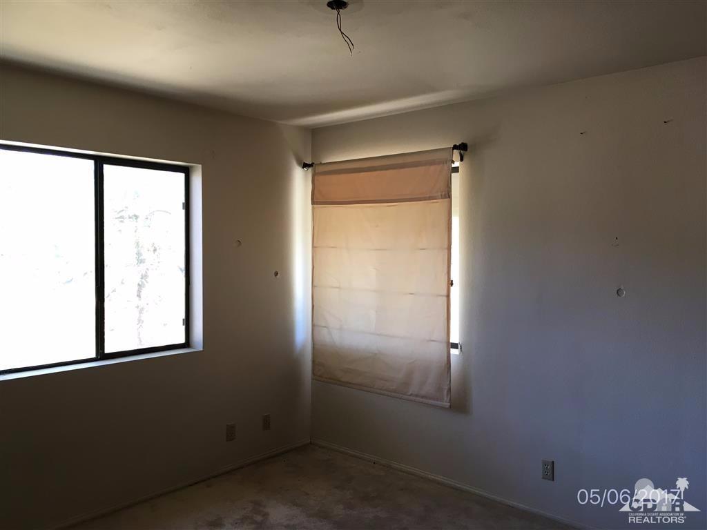 59371 Devils Ladder Road Mountain Center, CA 92561 - Photo 7 of 12 an empty room with windows and closet