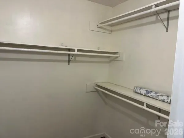 a bathroom with a granite countertop toilet a sink and bathtub