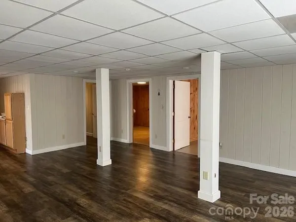 a kitchen with a refrigerator sink and cabinets