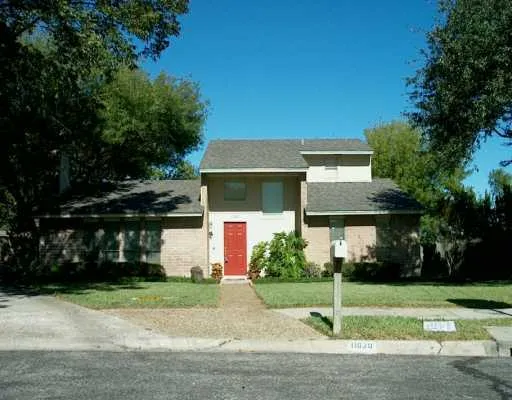 a front view of house with garage and yard