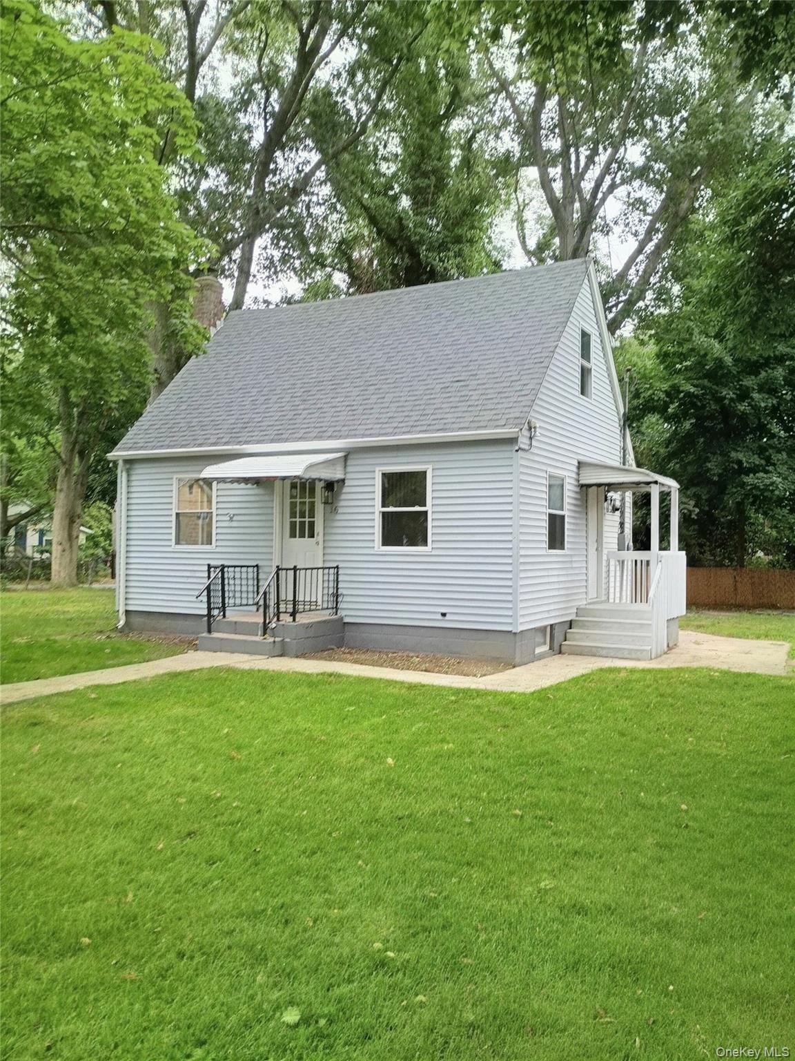 Maintenance free exterior, side door with overhang, large fenced corner lot