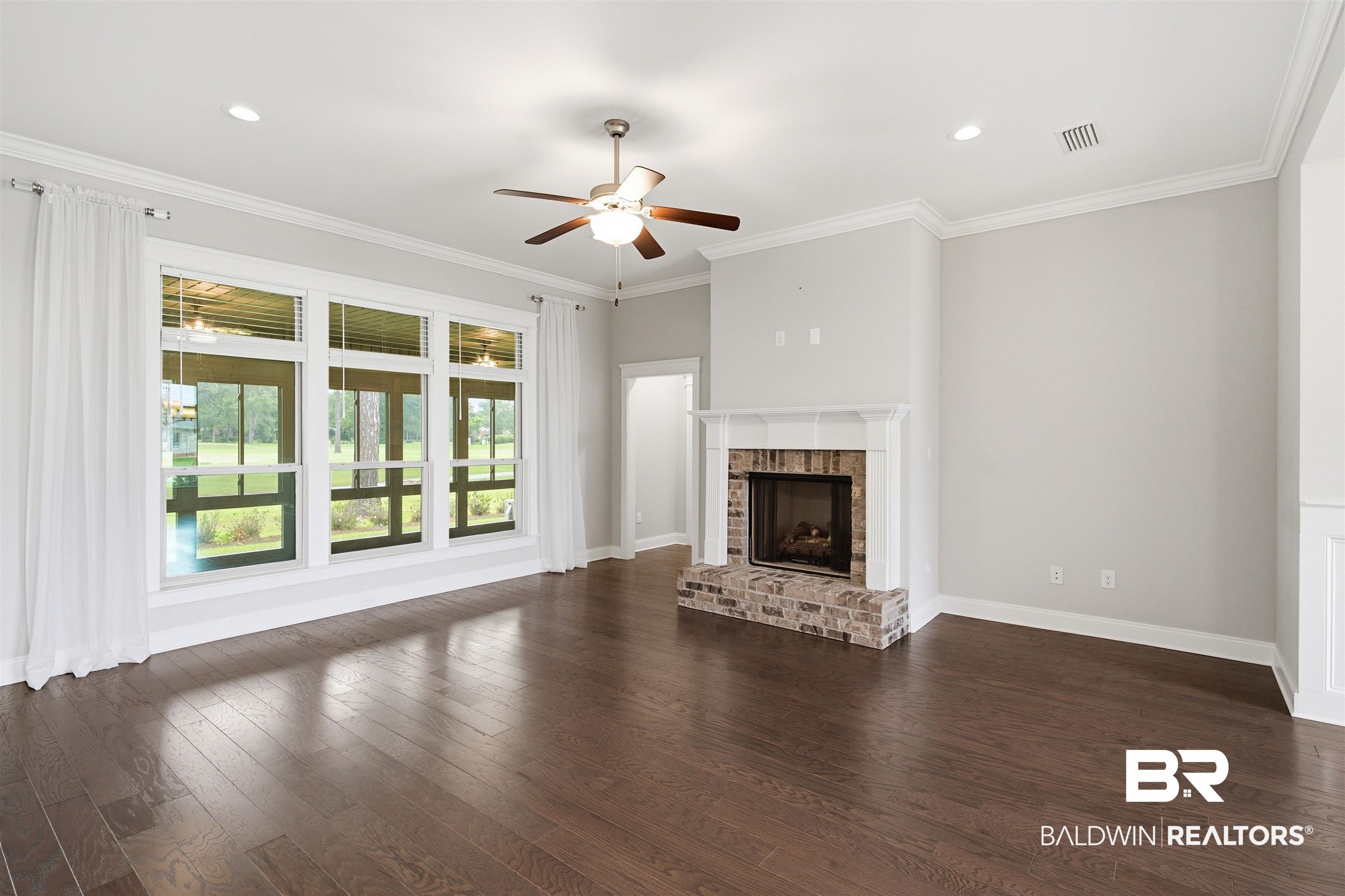 245 Divot Loop Fairhope, AL 36532 - Photo 7 of 26 Fireplace and windows overlooking Golf Course