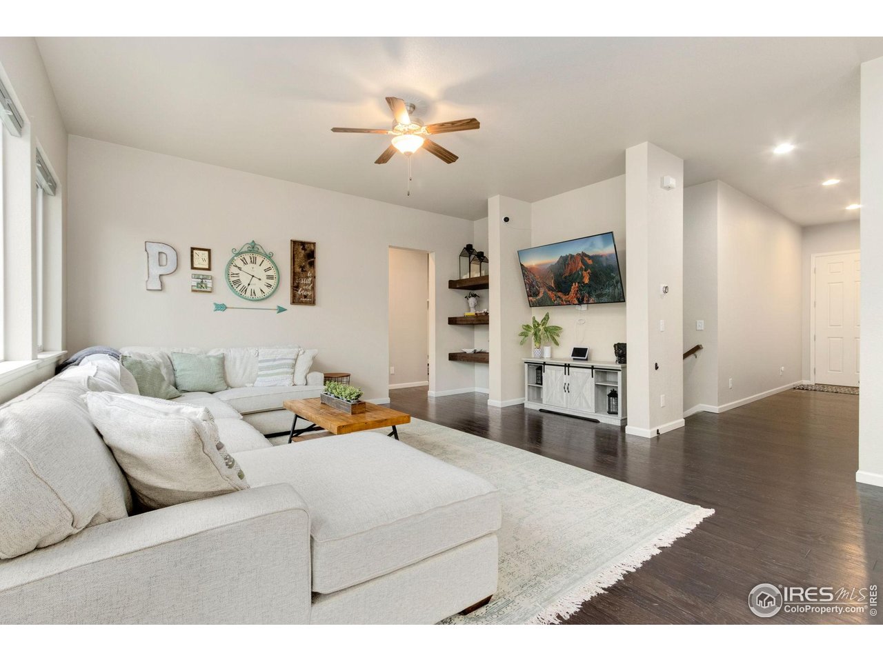 719 Wagon Bend Road Berthoud, CO 80513 - Photo 3 of 40 a living room with furniture and a flat screen tv
