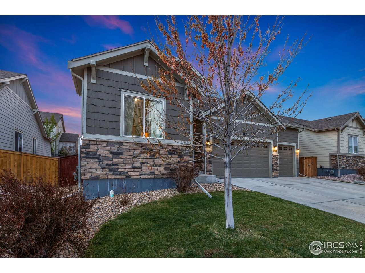 719 Wagon Bend Road Berthoud, CO 80513 - Photo 9 of 40 a front view of a house with a yard