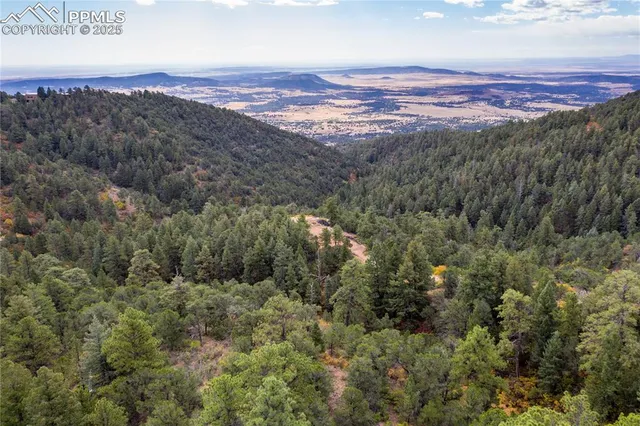 a view of a city with mountains in the background