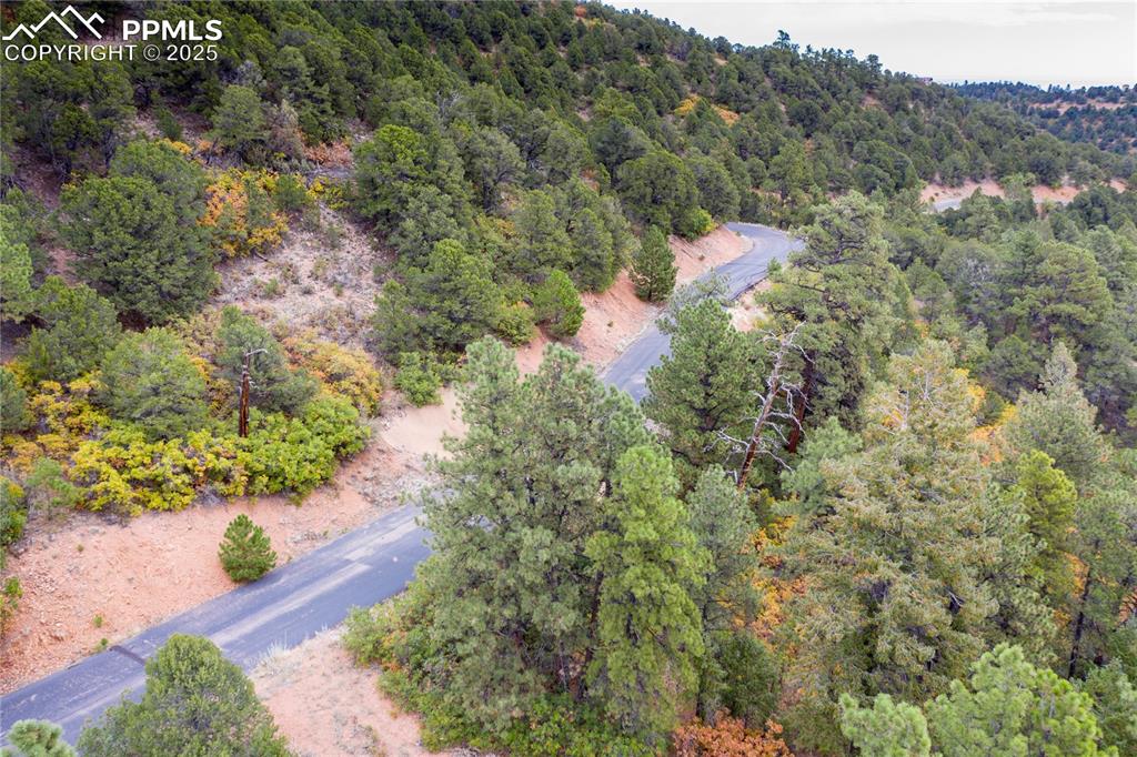 15825 Henry Ride Heights Colorado Springs, CO 80926 - Photo 5 of 23 an aerial view of house with yard and mountain view in back