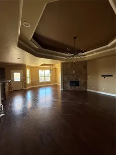 a view of room with window and wooden floor