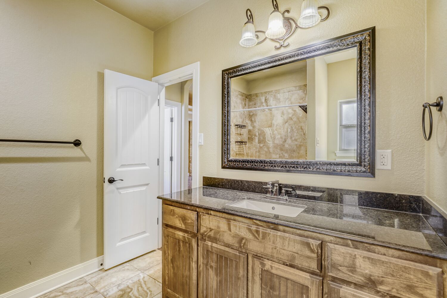 329 Jake Drive Jarrell, TX 76537 - Photo 9 of 17 Full bathroom featuring a textured wall, vanity, and tiled shower