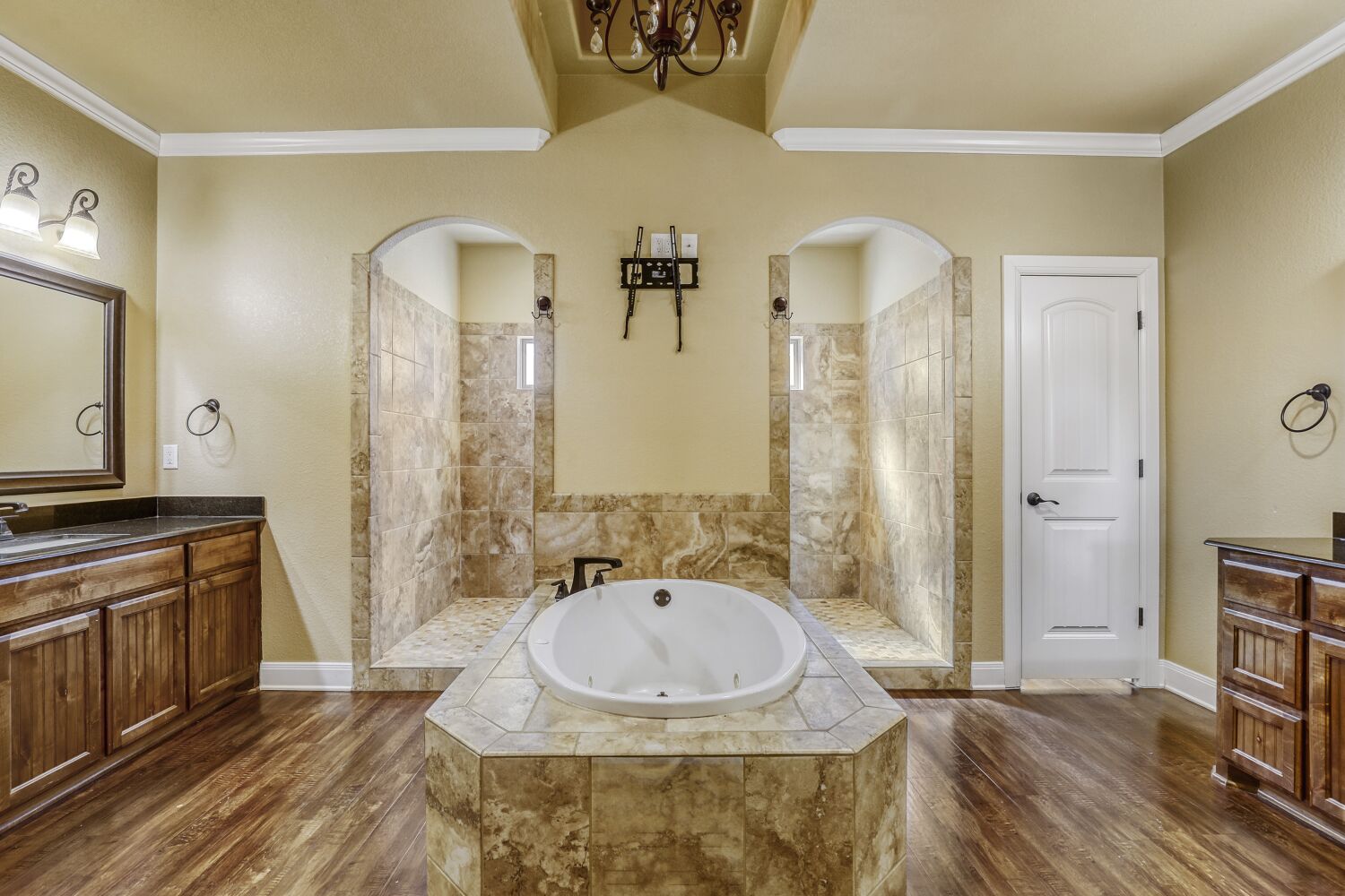 329 Jake Drive Jarrell, TX 76537 - Photo 10 of 17 Full bath featuring vanity, walk in shower, crown molding, a whirlpool tub, and dark wood-style flooring